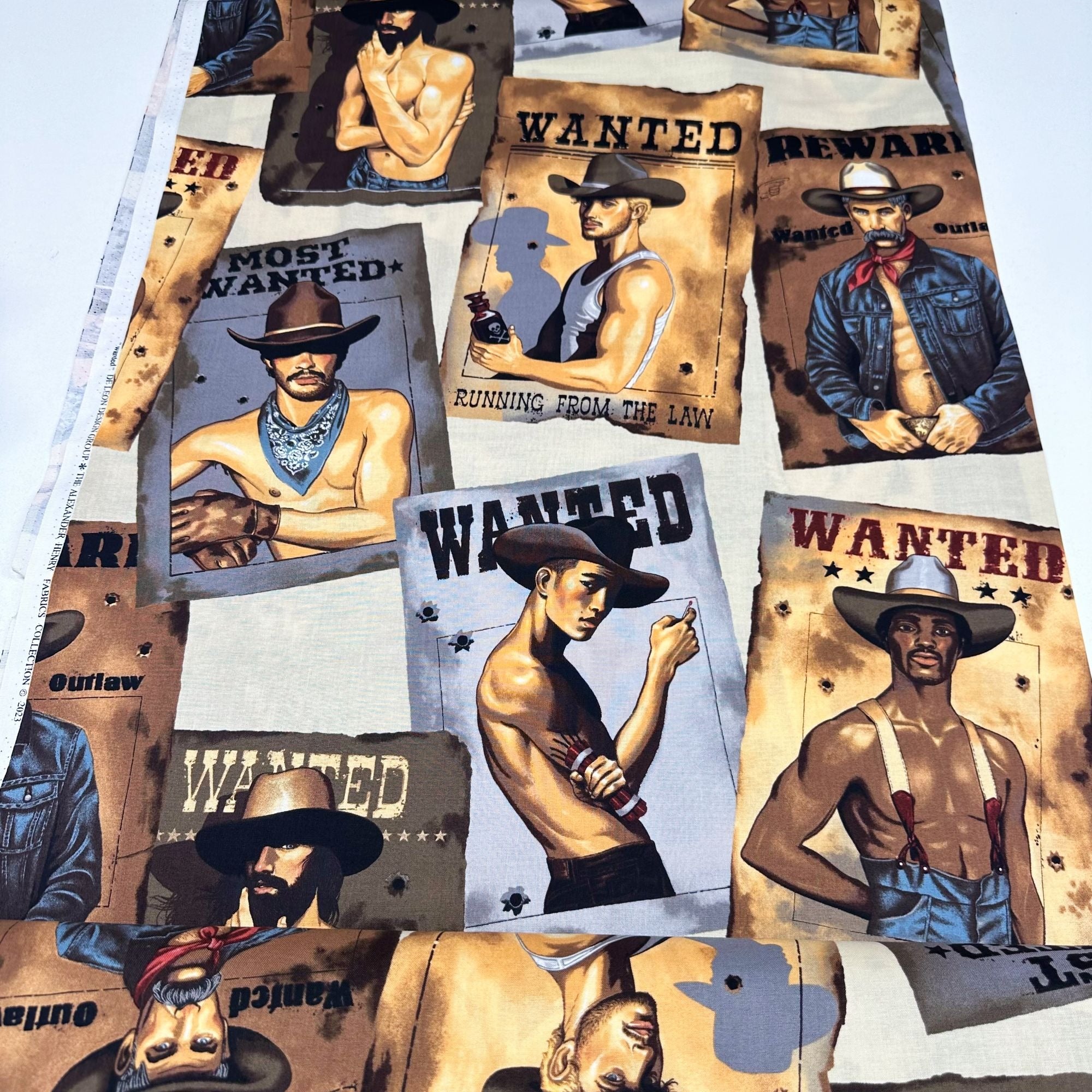 Wanted Sexy Outlaws Pin Up Men Cotton Fabric by Alexander Henry, Parchment