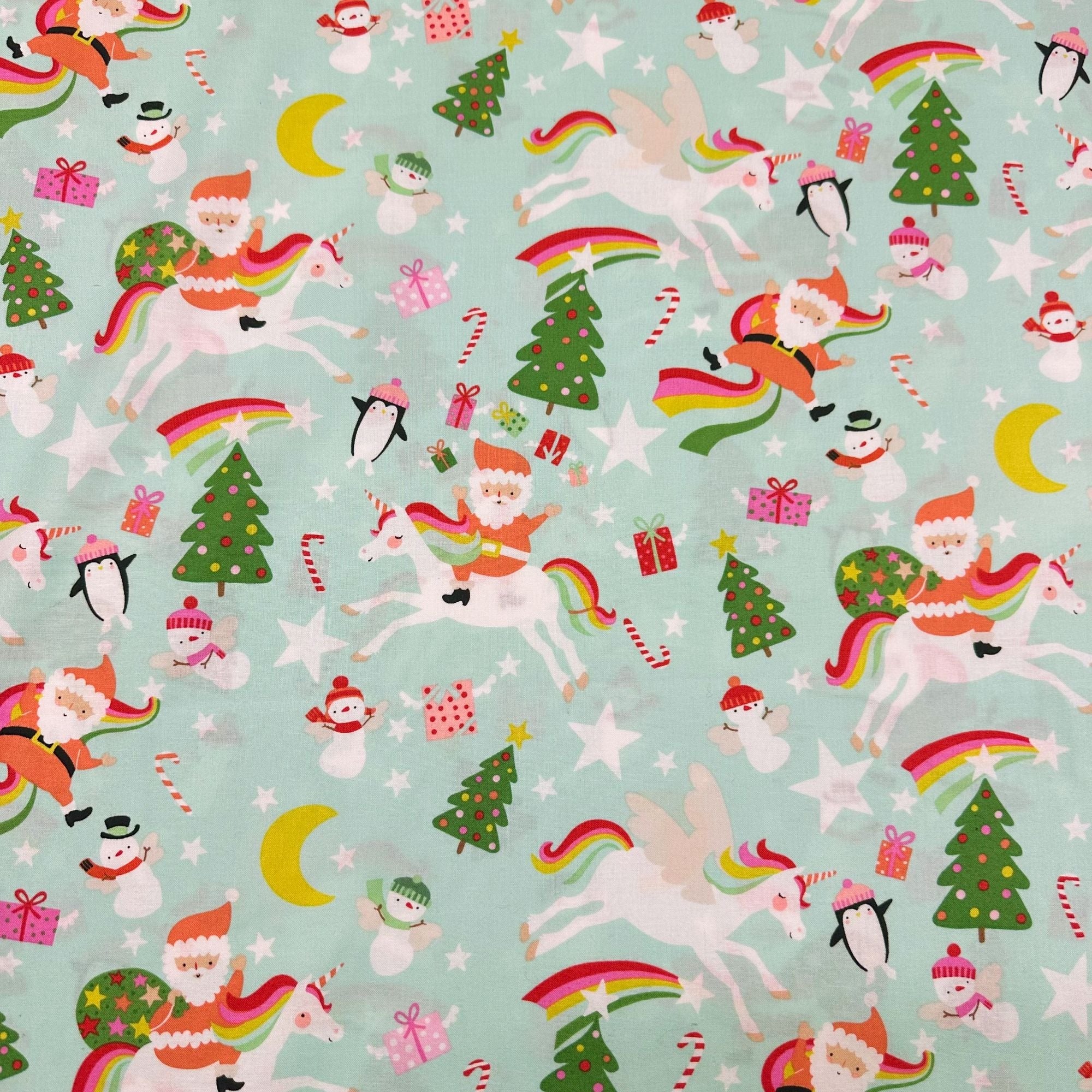 Yuletide Unicorn Cotton Fabric by Alexander Henry, 8894 B Christmas Santa Rainbows