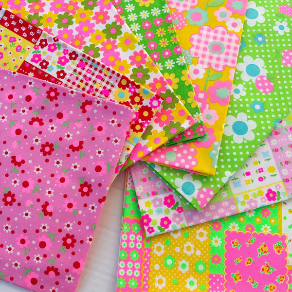 Close up of 8 piece neon fat quarter bundle by Antique Fabric Pinks