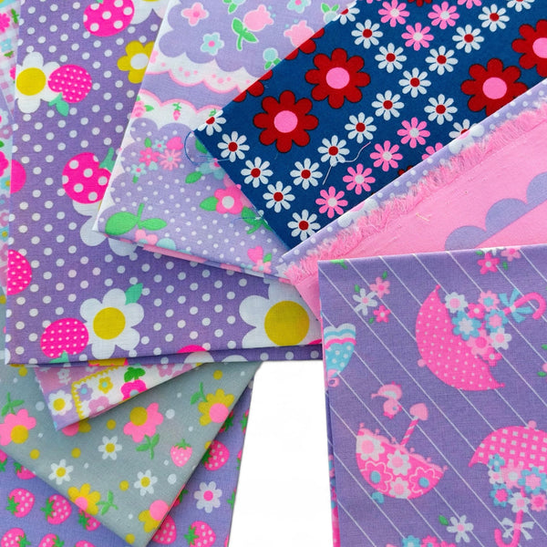 Close up of 8 piece neon fat quarter bundle by Antique Fabric Pinks