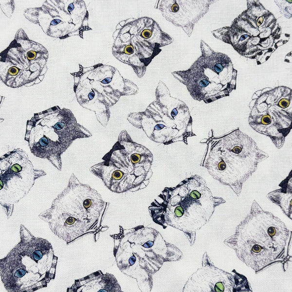 Cat Faces Cotton Fabric in White by Illustrator Ringo, Imported from Japan