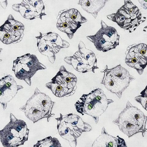 Cat Faces Cotton Fabric in White by Illustrator Ringo, Imported from Japan
