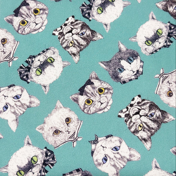 Cat Faces Cotton Oxford Fabric in Aqua by Illustrator Ringo, Imported from Japan