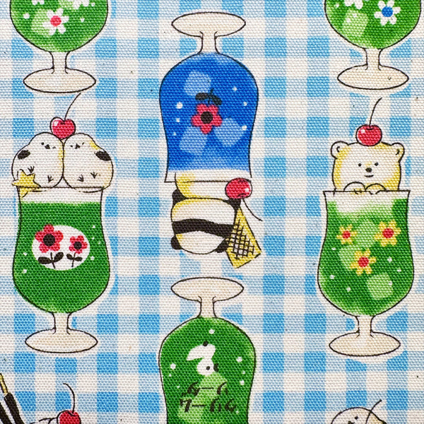 Close up of Delicious Animal Cream Soda blue cotton oxford fabric by Kokka Fabrics