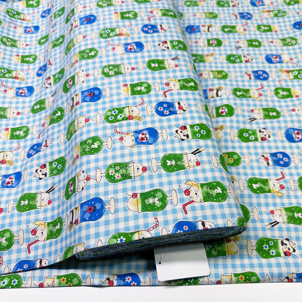 Delicious Animal Cream Soda blue cotton oxford fabric by Kokka Fabrics, Bolt view of playful animal print