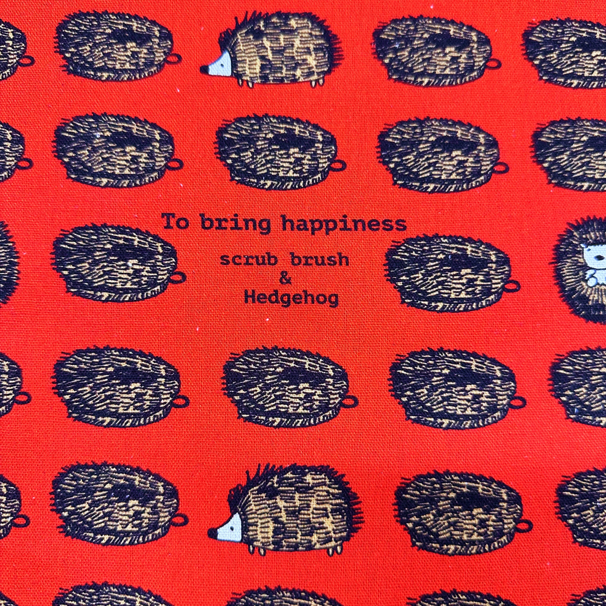 Hedgehog Scrub Brushes Canvas Fabric in Red - Cotton Linen Blend by Cotton Kobayashi