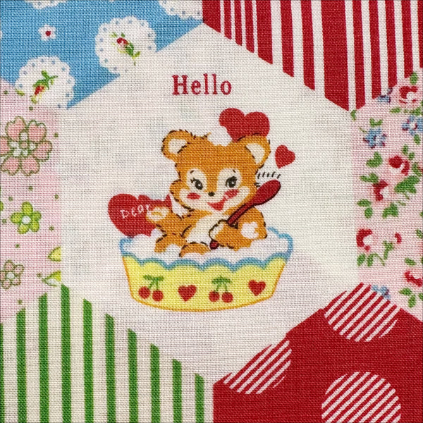Close up of Hexagon Animals Red cotton fabric from Atsuko Matsuyama Yuwa 30’s Collection, perfect for quilting and crafts.