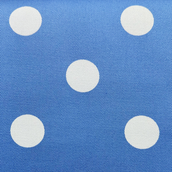 Close-up of medium polka dot blue cotton twill fabric by Sevenberry
