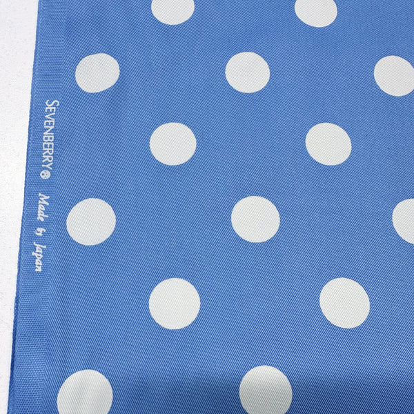 Selvage of medium polka dot blue cotton twill fabric by Sevenberry