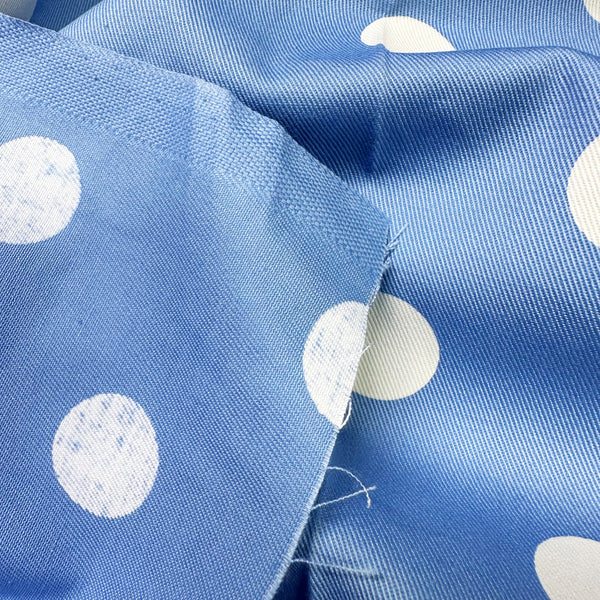 Super close-up of medium polka dot blue cotton twill fabric by Sevenberry