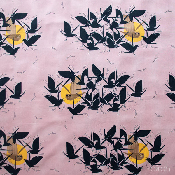 Owltercation organic cotton poplin fabric by Charley Harper for Birch Fabrics featuring an owl and blackbirds on a muted dusky mauve background.