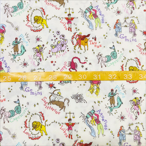 Scale of My Star Sign Cotton Fabric in Natural by Nora – quilt-weight cotton featuring illustrated zodiac-themed designs