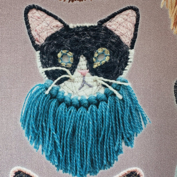 Close up of We Are Cats Cotton Fabric by Kari Ishikawa for Kokka, style EGX-9900-1, featuring yarn animal cat artwork