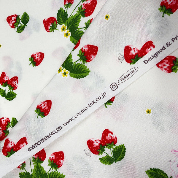 Selvage of Bunnies and Strawberries cotton fabric by Cosmo Textiles in white and red, SP2600 1A