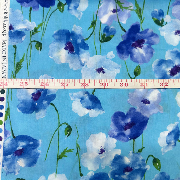 Scale of Flownny poppy flower cotton lawn fabric in blue by Kokka