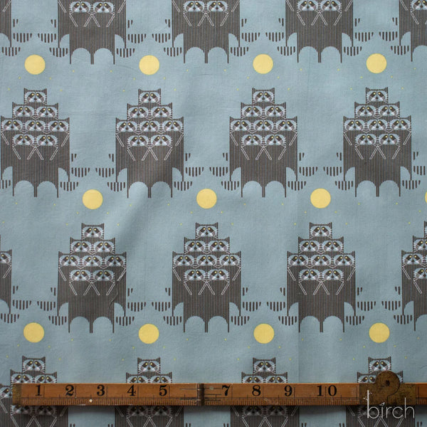 Scale of Raccpack organic cotton poplin fabric by Charley Harper for Birch Fabrics featuring raccoons in the moonlight on a dusky teal background.