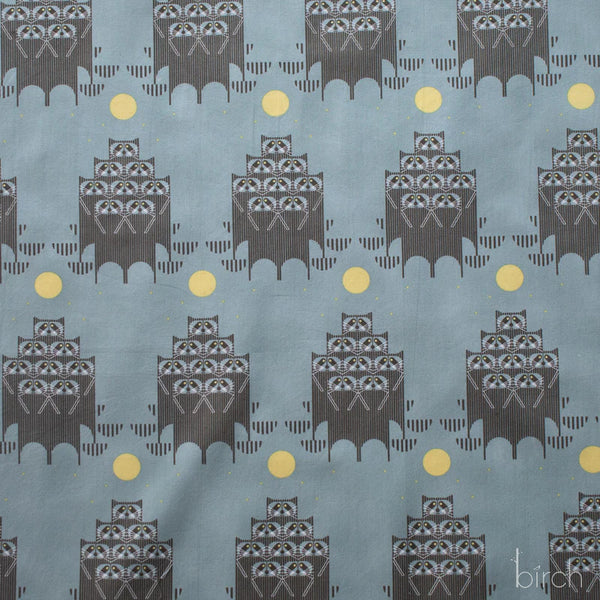 Raccpack organic cotton poplin fabric by Charley Harper for Birch Fabrics featuring raccoons in the moonlight on a dusky teal background.