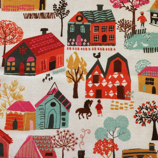 Close up of Fine Folk Little Village cotton fabric by Helen Black, style FOLK1111