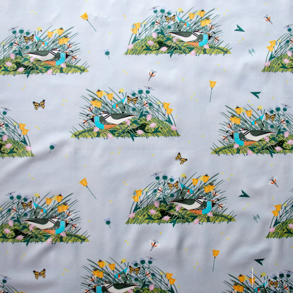 Small Once There Was A Field organic cotton poplin fabric by Charley Harper for Birch Fabrics featuring birds, bugs, and blooms on a pale blue background.