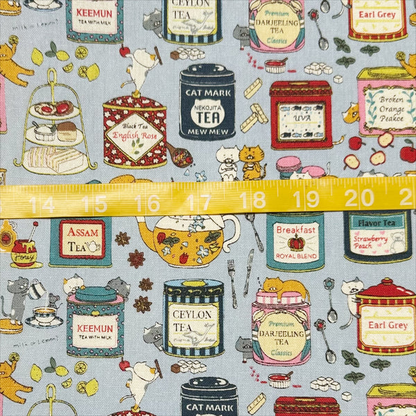 Scale of Tea Cats Canvas Fabric in Blue by Cotton Kobayashi – silly cats playing and drinking tea on cotton linen canvas, imported from Japan