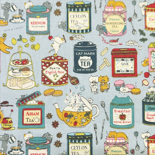Tea Cats Canvas Fabric in Blue by Cotton Kobayashi – silly cats playing and drinking tea on cotton linen canvas, imported from Japan