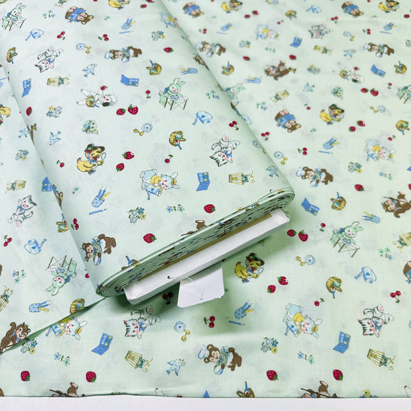 Bolt of Tiny Animals mint cotton fabric from Atsuko Matsuyama Yuwa 30’s Collection, perfect for quilting and crafts.