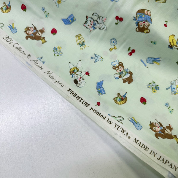 Selvage of Tiny Animals mint cotton fabric from Atsuko Matsuyama Yuwa 30’s Collection, perfect for quilting and crafts.