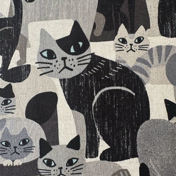 Close up of Art Animal Cats Cotton Linen Blend Canvas Fabric by Kokka, style YGA-91060 1B, featuring cat illustrations, in gray and multi