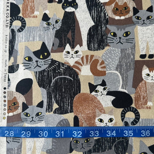 Scale of Art Animal Cats Cotton Linen Blend Canvas Fabric by Kokka, style YGA-91060 1D, featuring cat illustrations, in brown and multi
