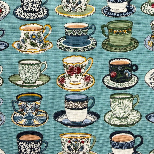 Close up of Art Nouveau Symphony Tea Cups cotton fabric in teal