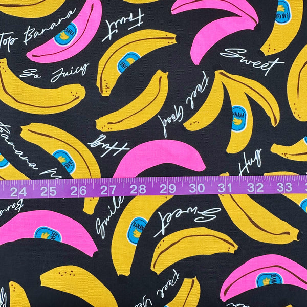 Scale of Banana Mood cotton Oxford fabric in neon pink and black Japanese import fabric featuring a banana print
