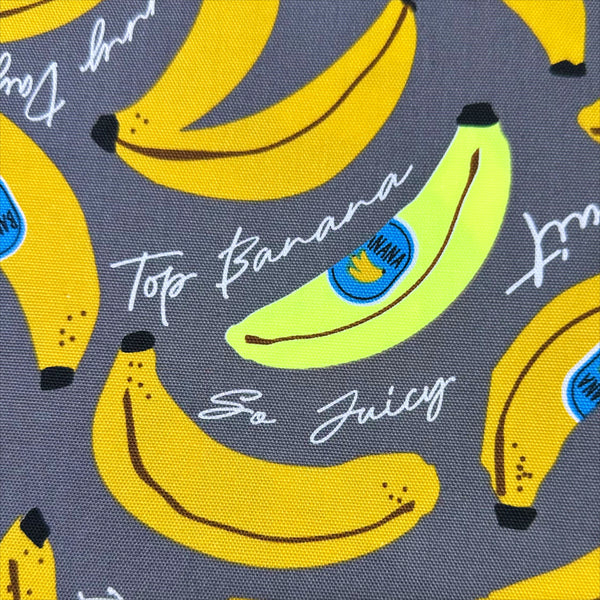 Close up of Banana Mood Oxford cotton fabric in neon yellow and gray, Japanese Import, medium weight cotton for sewing and quilting
