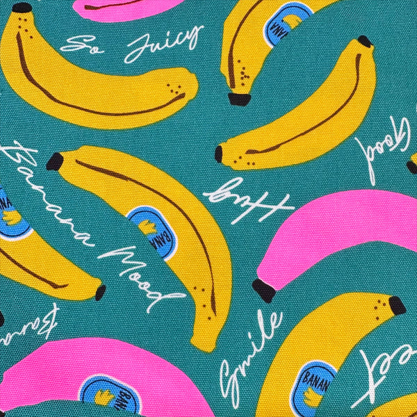 Close up of Banana Mood Oxford cotton fabric in teal and neon pink, Japanese Import, medium weight cotton for sewing and quilting