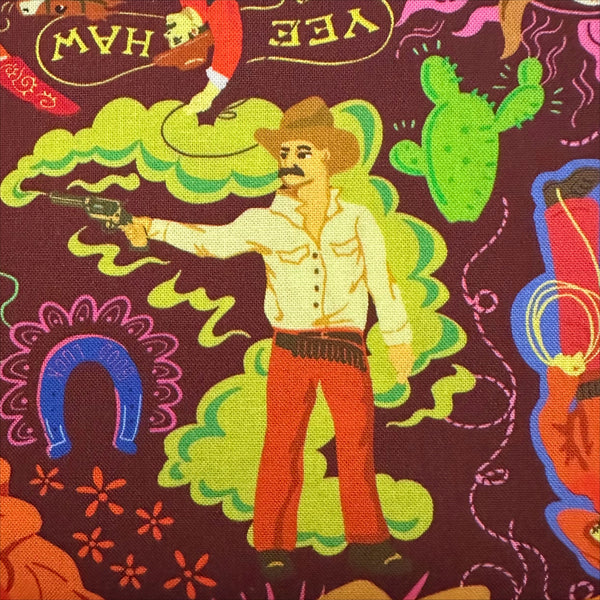 Close up of Bang cotton fabric by Nora in deep maroon with colorful cowboy western print, imported from Japan
