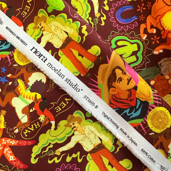 Scale of Bang cotton fabric by Nora in deep maroon with colorful cowboy western print, imported from Japan