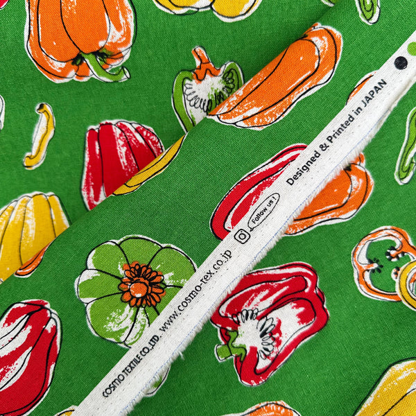 Selvage of Bell Pepper Canvas Fabric by Cosmo Textiles, style AP62105-D, featuring bell pepper print, in green