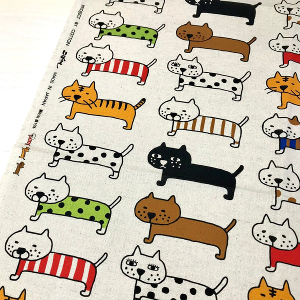 Big Cats Parade canvas fabric in natural by Cotton Kobayashi