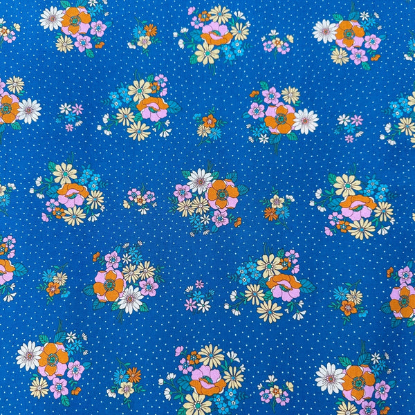 Full view of Bloom Garland Retro Floral and Polka Dot Cotton Fabric by Koko Seki, in blue, imported from Japan