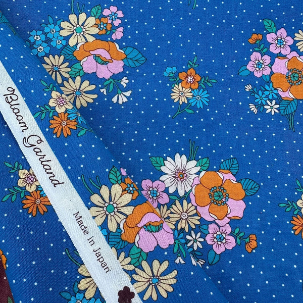 Selvage of Full view of Bloom Garland Retro Floral and Polka Dot Cotton Fabric by Koko Seki, in blue, imported from Japan