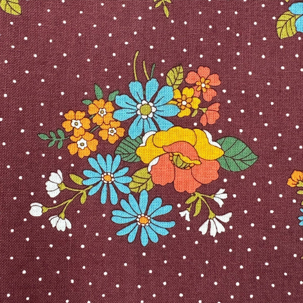 Close up of Bloom Garland Retro Floral and Polka Dot Cotton Fabric by Koko Seki in brown, imported from Japan