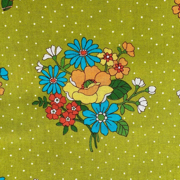 Close up of Bloom Garland Retro Floral and Polka Dot Cotton Fabric by Koko Seki, in green, imported from Japan