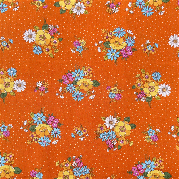 Full view of Bloom Garland Retro Floral and Polka Dot Cotton Fabric by Koko Seki, in orange, imported from Japan
