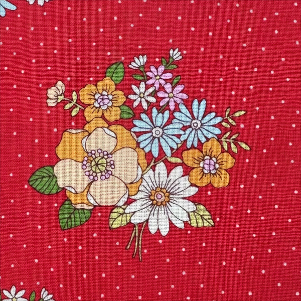 Close up of Bloom Garland Retro Floral and Polka Dot Cotton Fabric by Koko Seki, in red, imported from Japan