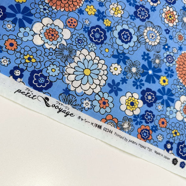 Selvage of Blue floral cotton fabric by Petit Voyage, imported from Japan