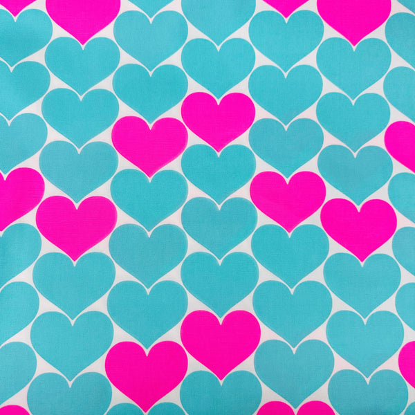 Bon Bon Heart cotton Oxford fabric in neon pink and aqua blue featuring a large-scale heart print, imported from Japan
