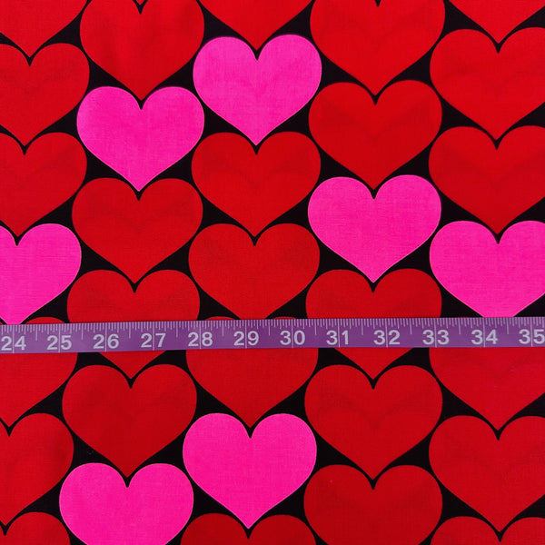 Scale of Bon Bon Heart cotton Oxford fabric in neon pink and black featuring a large-scale heart print, imported from Japan