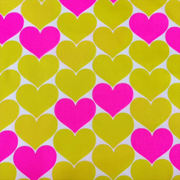 Bon Bon Heart cotton Oxford fabric in neon pink and yellow featuring a large-scale heart print, imported from Japan