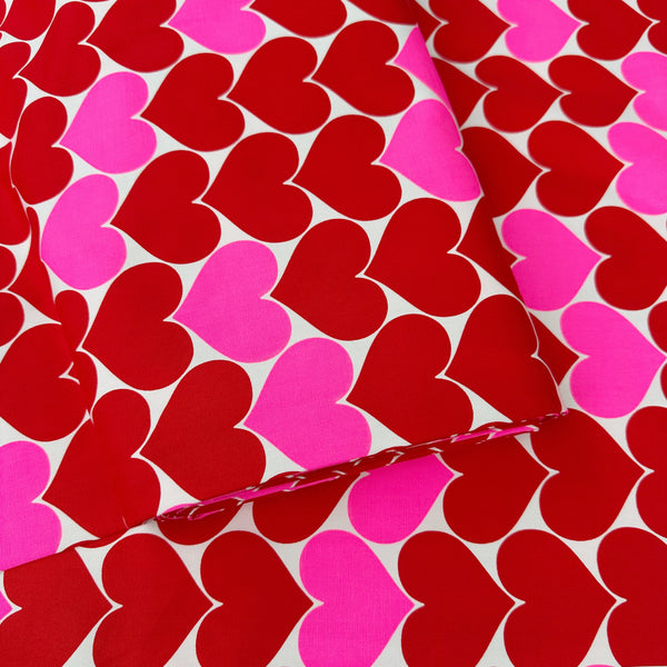 Bolt of Bon Bon Heart cotton Oxford fabric in red and white featuring a large-scale heart print, imported from Japan