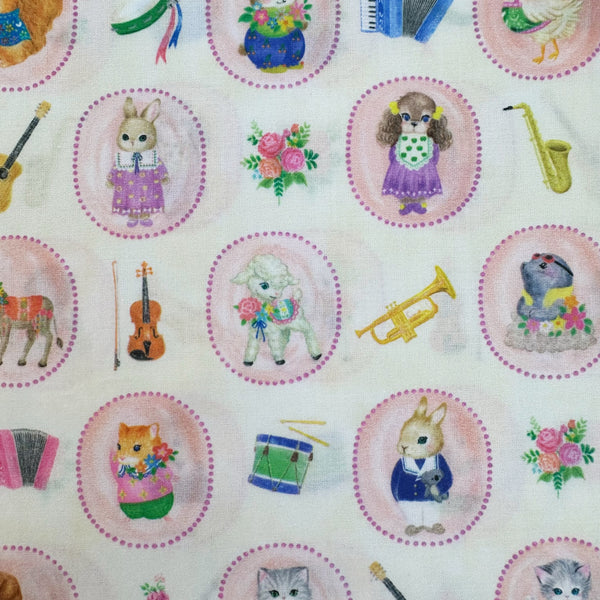 Animals in Bon Bon Journey Cotton Lawn Fabric in Ivory by Yukiemon for Hokkoh featuring whimsical travel-themed illustrations on soft Japanese cotton lawn.