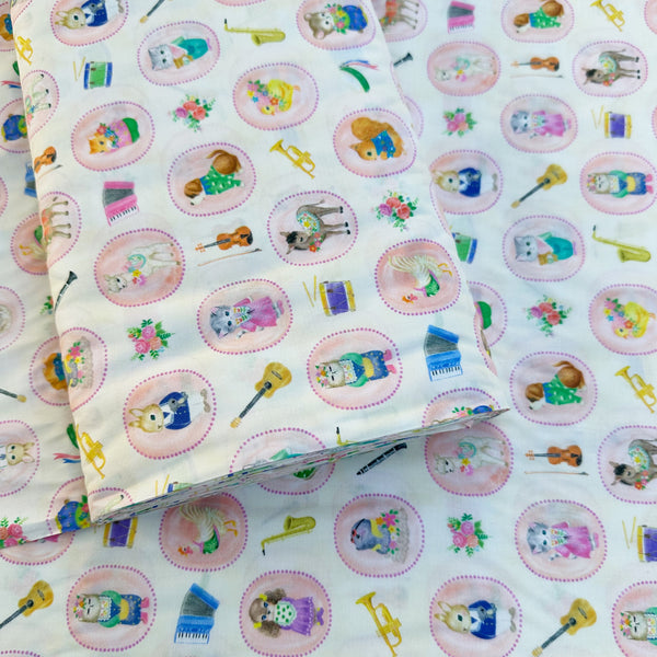 Bolt of Bon Bon Journey Cotton Lawn Fabric in Ivory by Yukiemon for Hokkoh featuring whimsical travel-themed illustrations on soft Japanese cotton lawn.